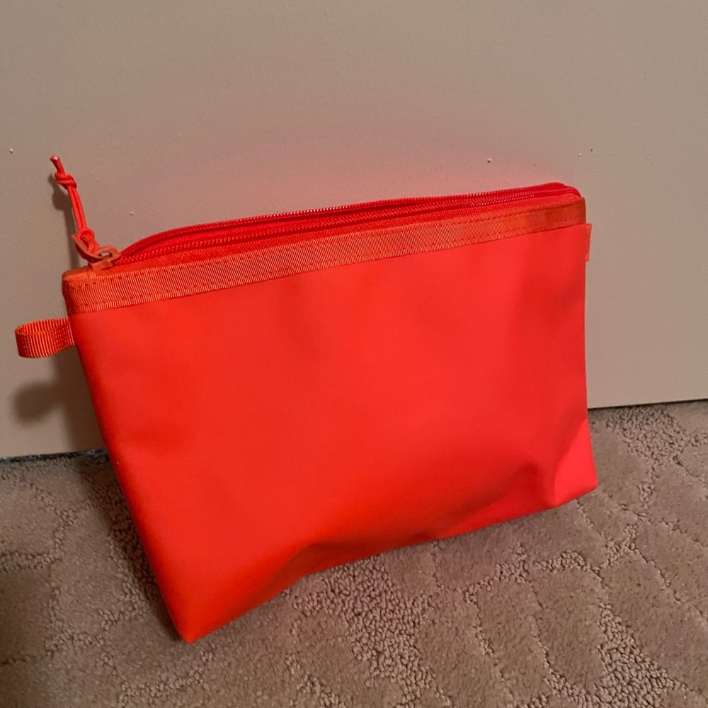 Baboon to the Moon orange pouch